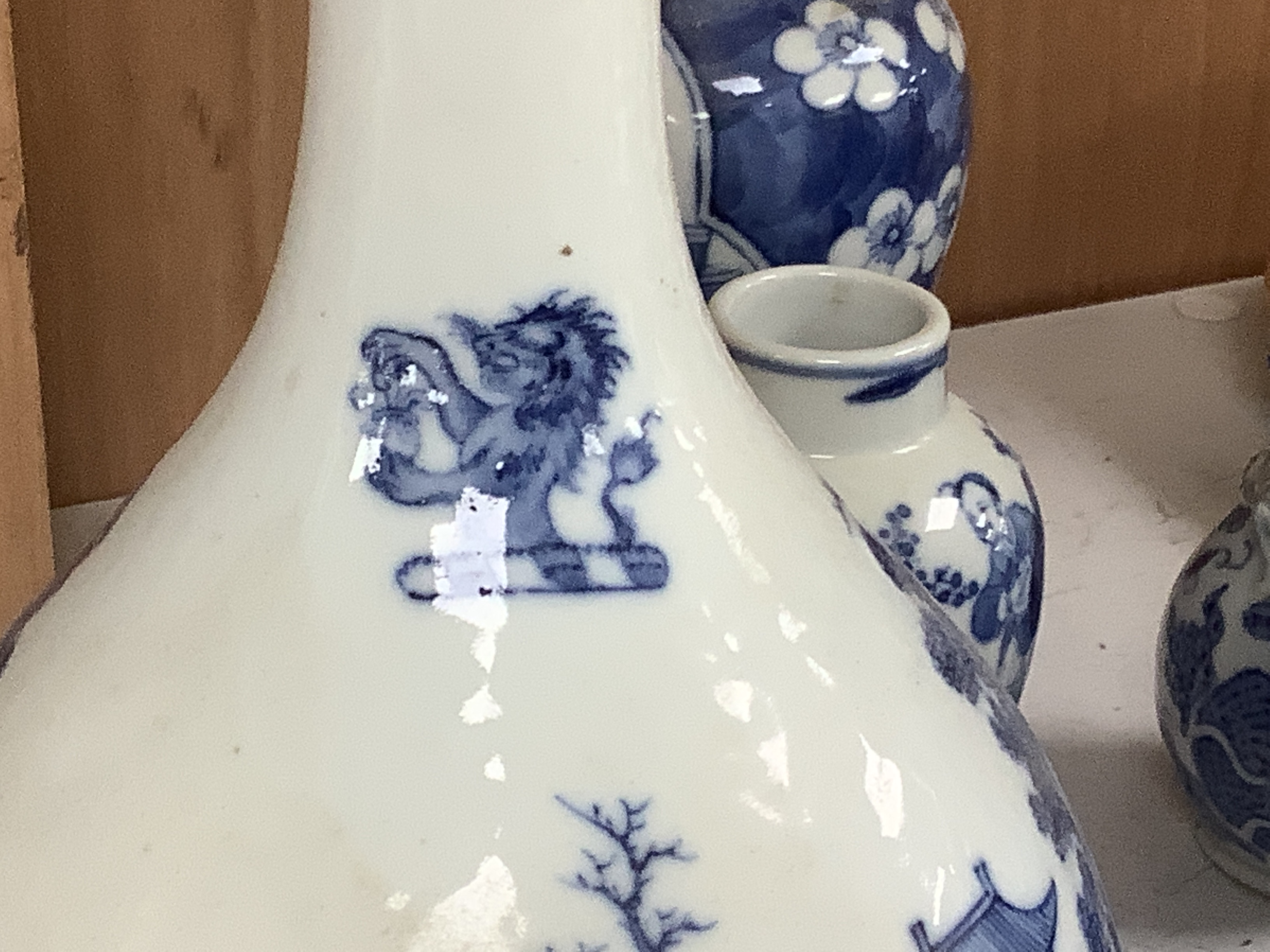 A Chinese armorial blue and white bottle vase, Qianlong/Jiaqing period, and five assorted 19th century Chinese blue and white vases, tallest 20cm; faults
